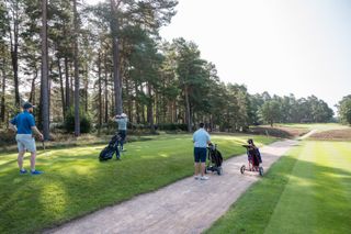 Golfer teeing off