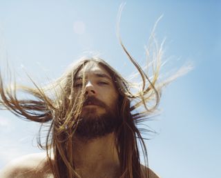 NeoNutritions campaign image: man with beard and long hair in sunshine