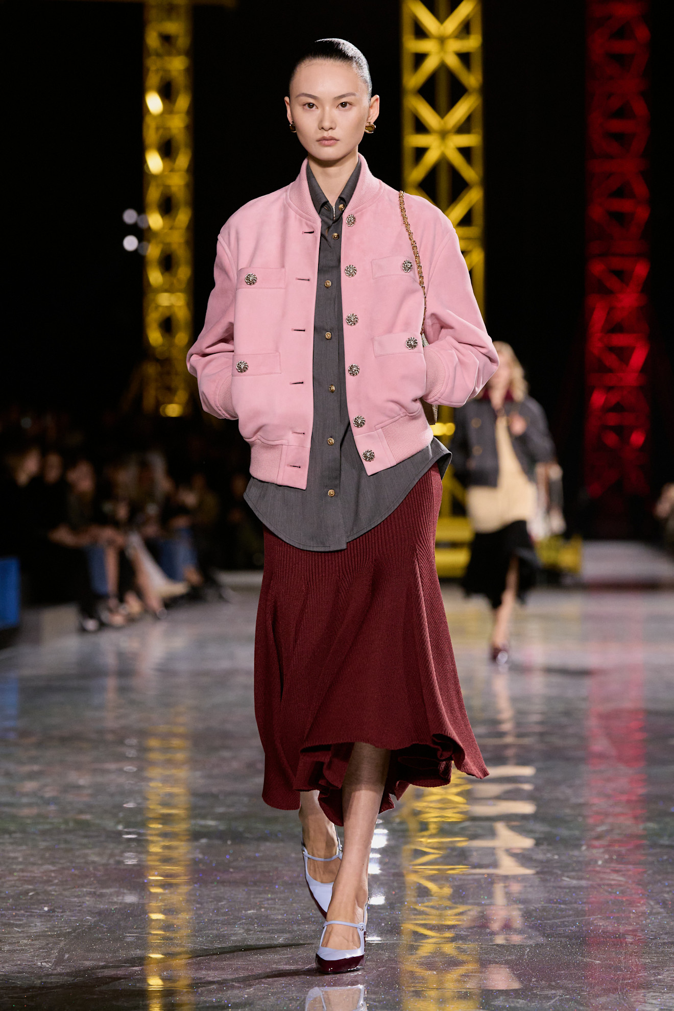 a model on the runway at chanel aw26