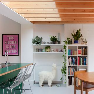 open plan kitchen diner white and timber with pops of colour