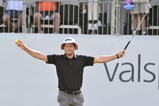 Peter Malnati raises his arms in the air after his Valspar Championship victory