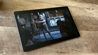 Lenovo Tab P11 Pro Gen 2 tablet displaying Netflix show on wooden surface