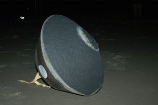 A view of Stardust's sample-return capsule after it successfully touched back down on Earth, under parachute, in 2006.