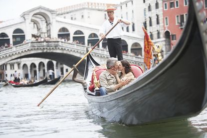 A couple on a boat ride in Venice.