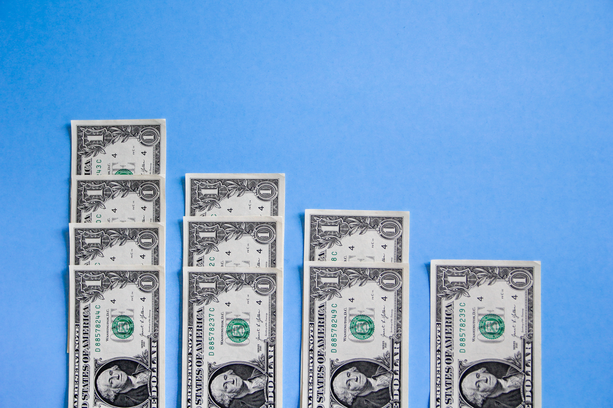 US Dollar notes on blue background