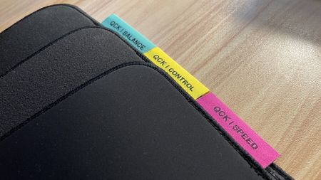 SteelSeries QcK Performance mouse pads overlapping on a desk