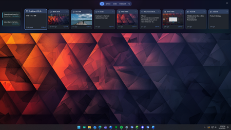 Stardock Snipboard dock running on a Windows 11 desktop. The dock shows various recent clipboard items including text and image previews, with options for filtering and searching.