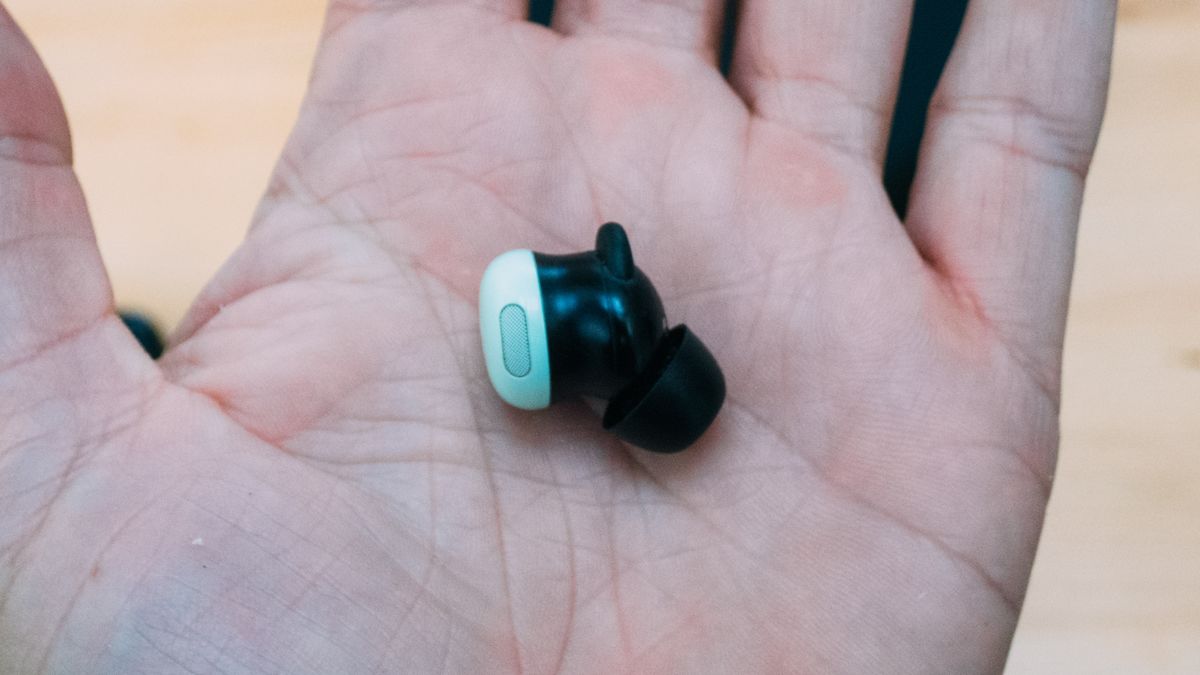 Google Pixel Buds Pro 2 ear bud in the palm of a hand