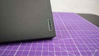 A Lenovo ThinkPad X1 Nano Gen 3 on a desk with a purple desk mat