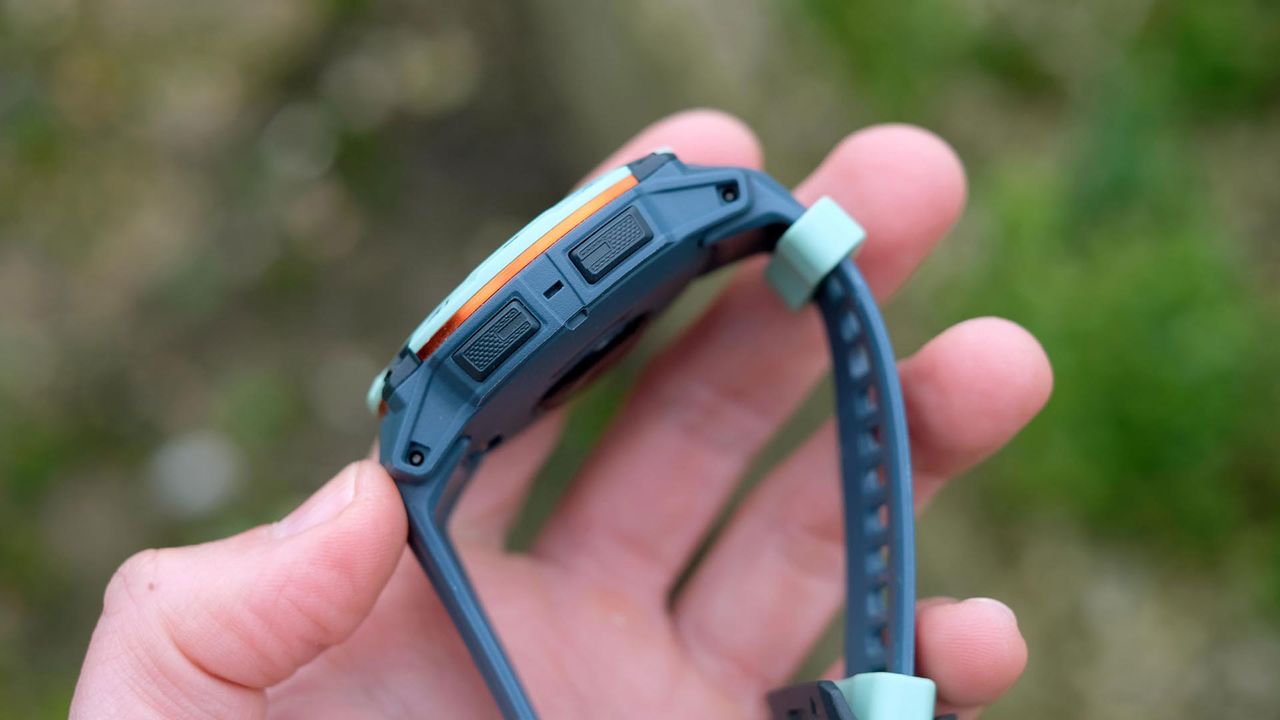 Garmin Instinct 3 held in hand by our reviewer