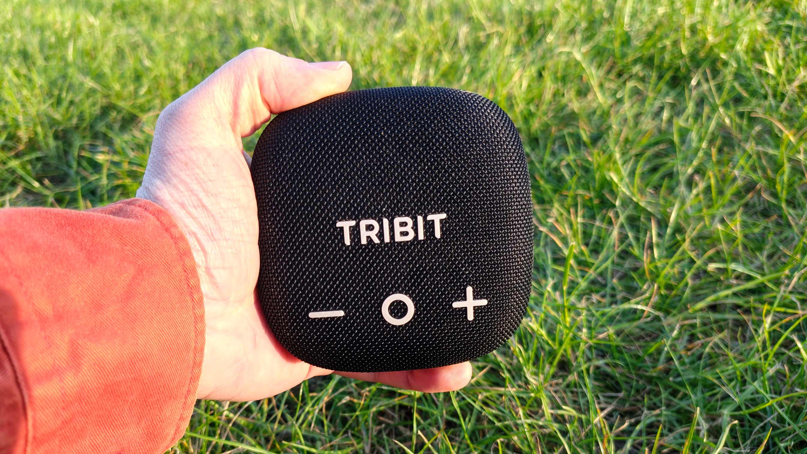 The Tribit Stormbox Micro 3 on a grassy backdrop.