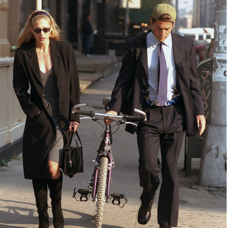 Newlyweds John F Kennedy Jr. and Carolyn Bessette Kennedy walk along Varick Street.