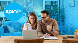 A young couple sitting at a table, looking happy whilst looking at a laptop. The background is blue and the SpinTel logo is in the top left.