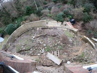 A birds-eye view of the area showing the collapsed wall and sunken land where the patio was meant to have been built