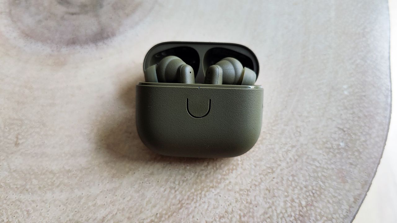 Urbanears Boo review: true wireless earbud on a table next to the matching case