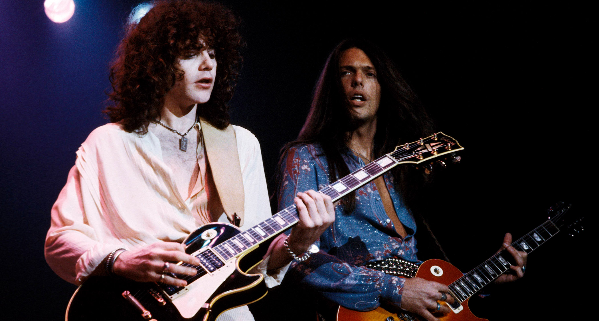 Scott Gorham [right] and Brian Robertson of Thin Lizzy, long-haired, playing Les Pauls onstage with the legendary Irish rock institution in 1978