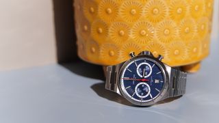 The Certina DS-7 Chrono Auto against a yellow pot