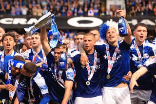 Ipswich Town players celebrate after winning the Championship play-off final against Huddersfield Town and promotion to the Premier League in May 2024.