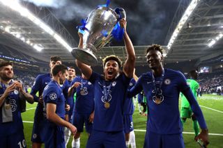 Chelsea right-back Reece James celebrates with the Champions League trophy