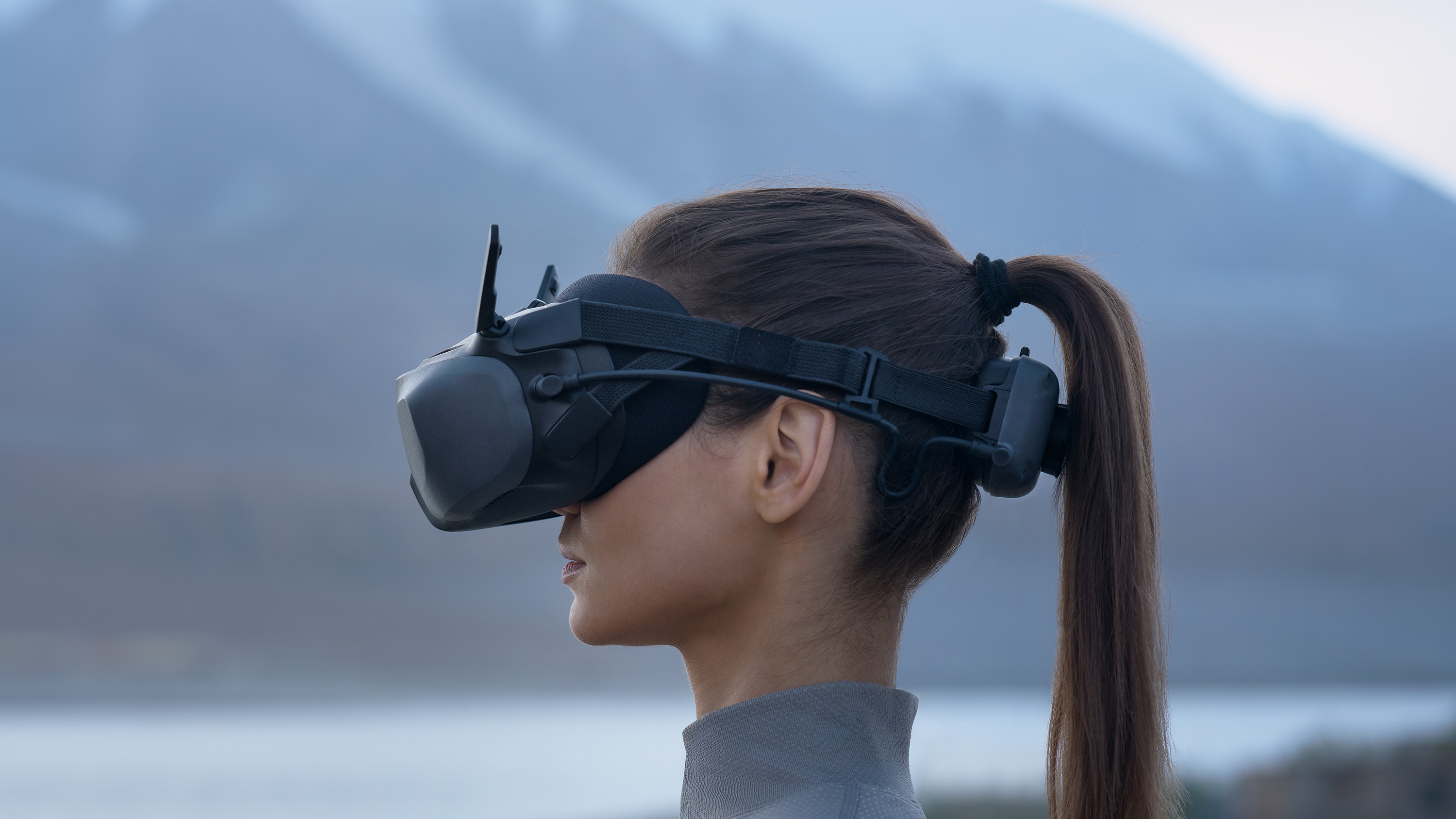 Person wearing DJI Goggles N3 with mountainous backdrop