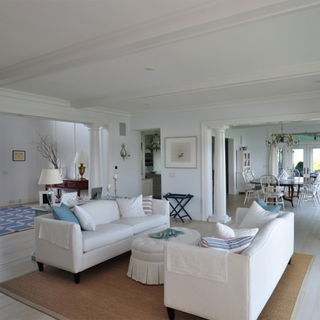 living room with sofaset and white walls