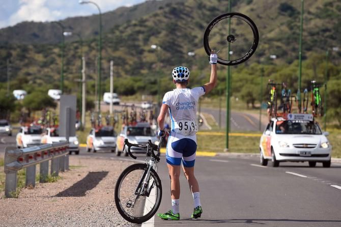 Andrea Peron waits for a new tire during stage 2.