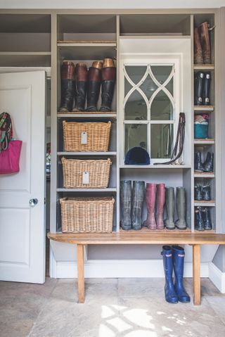 single wall, small boot room with built in storage and baskets