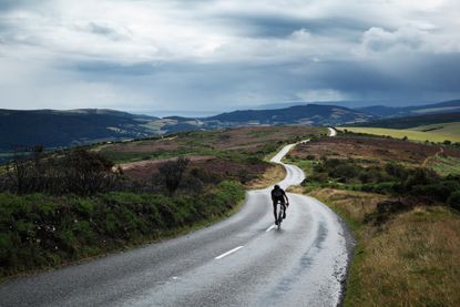 Cyclist riding to lose weight