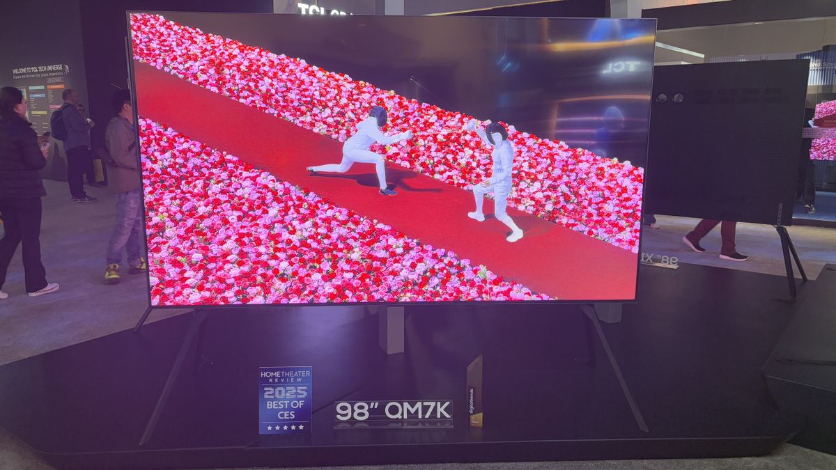TCL QM7K at the TCL stand with a tennis player and fencers on screen