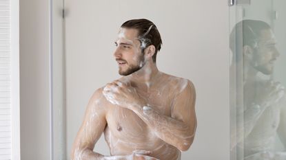 Man in the shower using a body wash