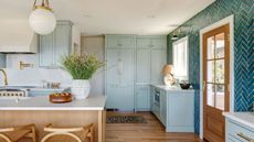 modern kitchen with light teal cabinets