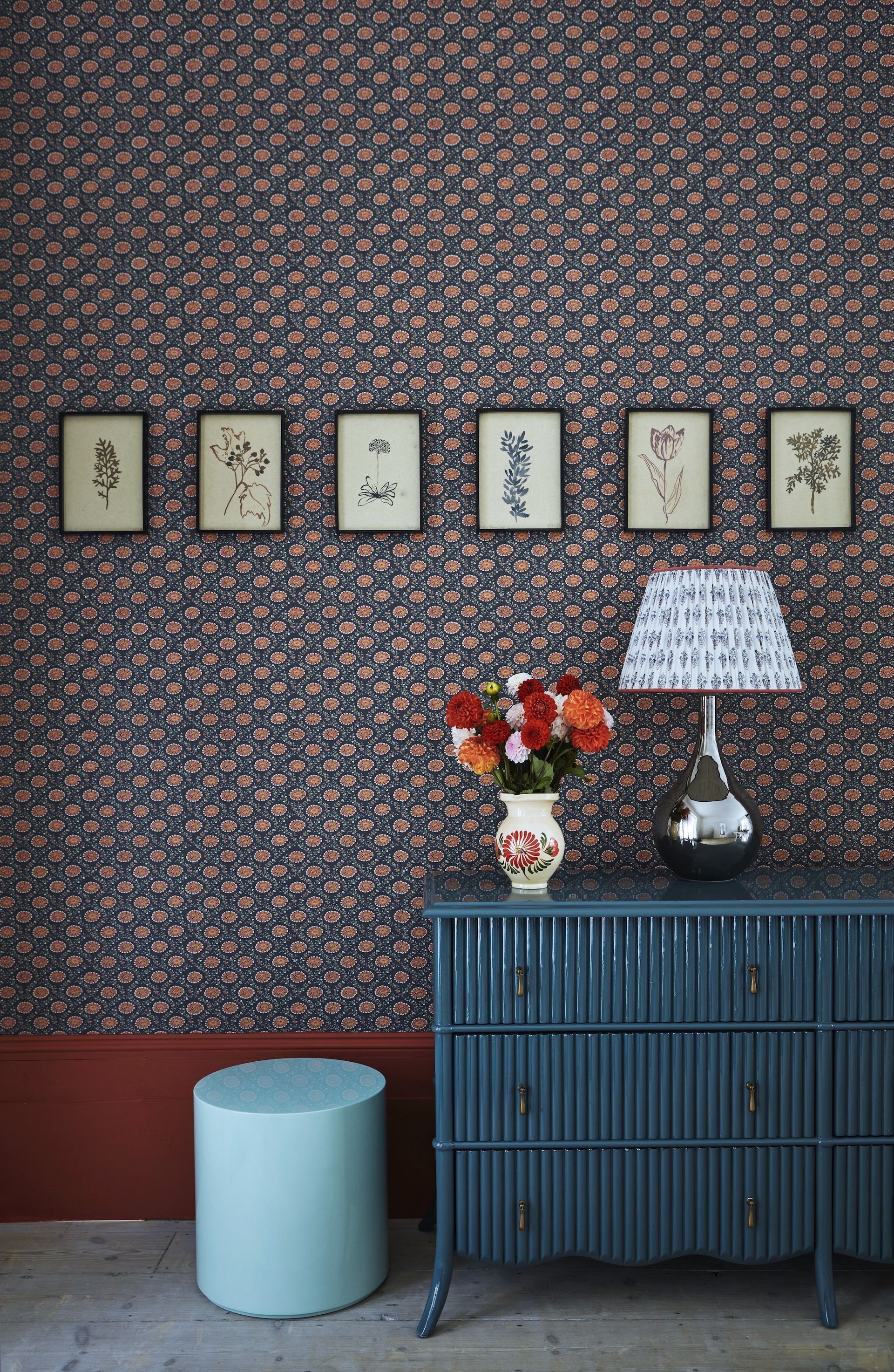 entryway with blue and red wallpaper