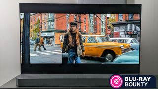 Blu-ray Bounty header image with Panasonic OLED showing Timothee Chalamet in A Complete Unknown 