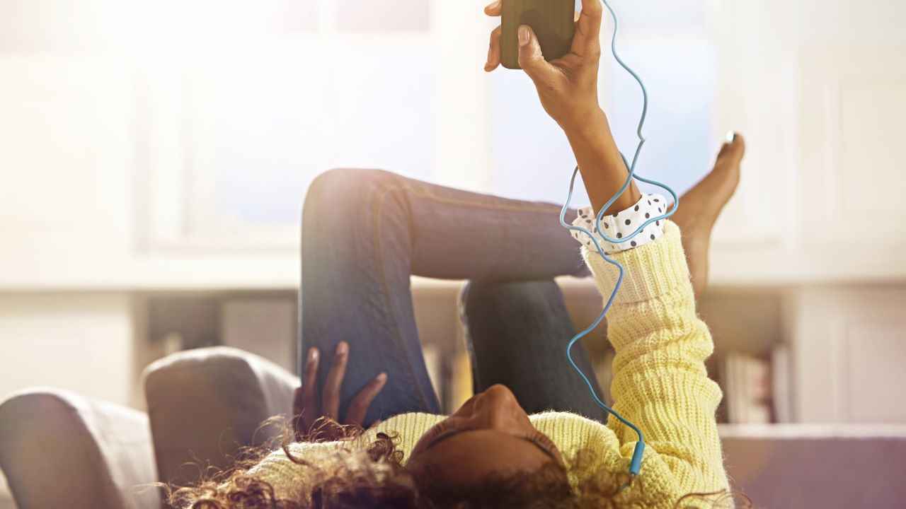 woman listening to headphones