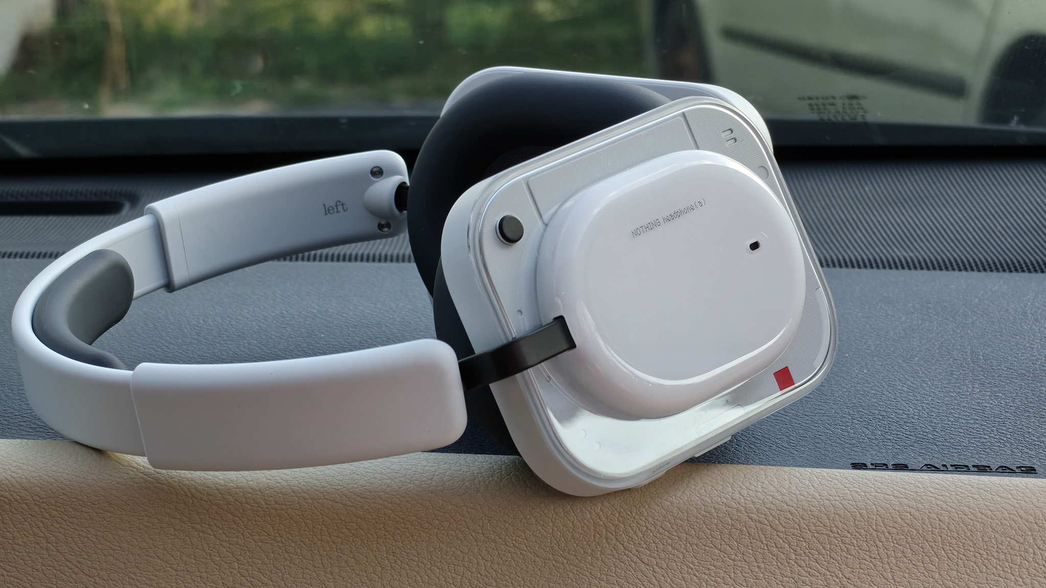 A pair of white Nothing Headphone (a)