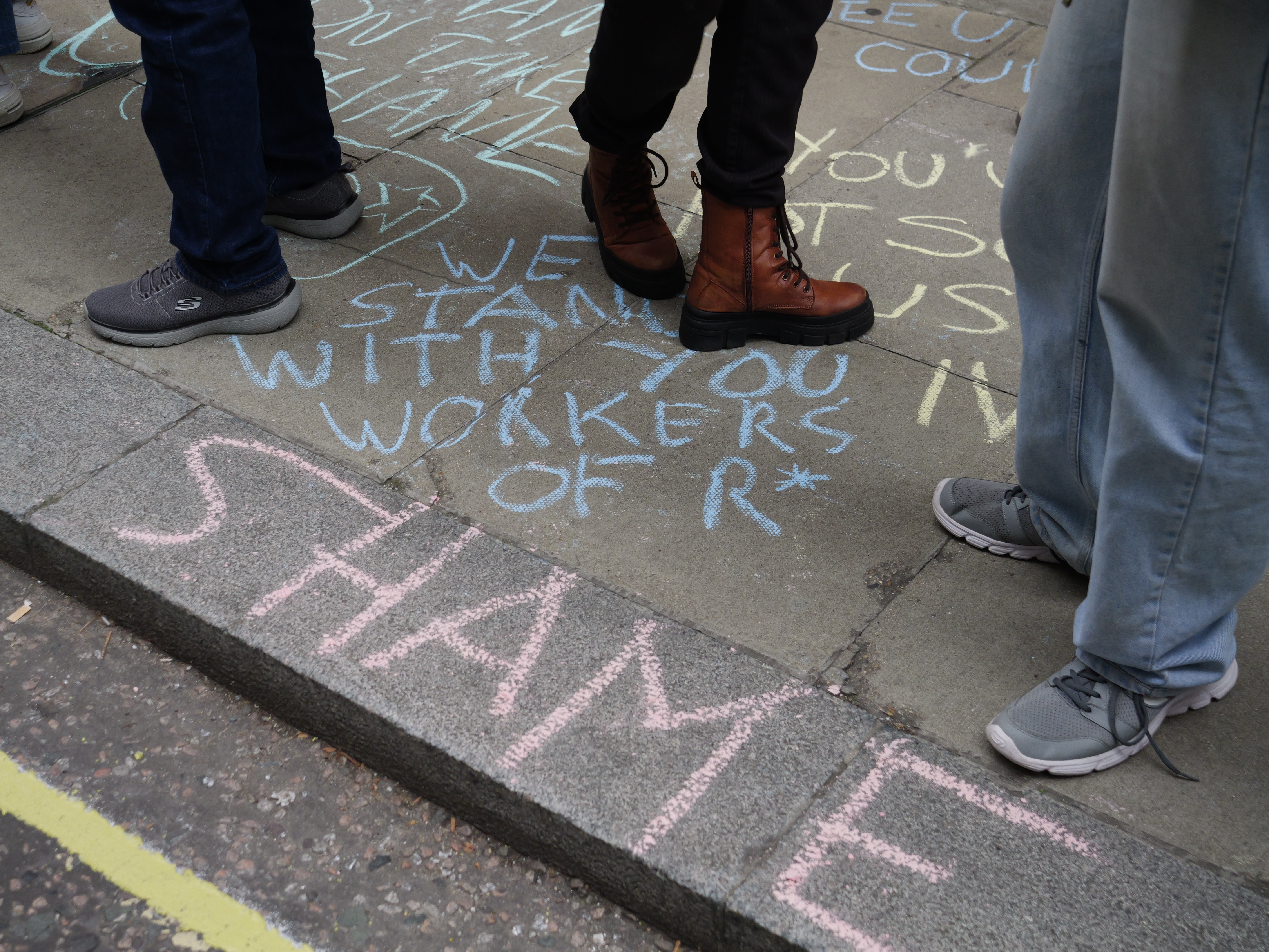 Pro-union slogans on the pavement in chalk.