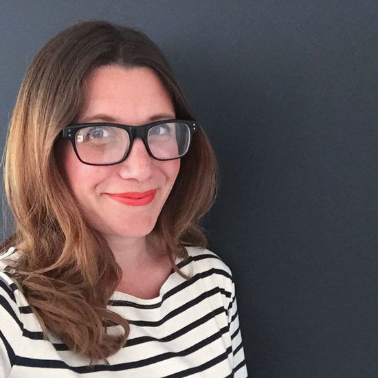 author heather young with striped top and glasses