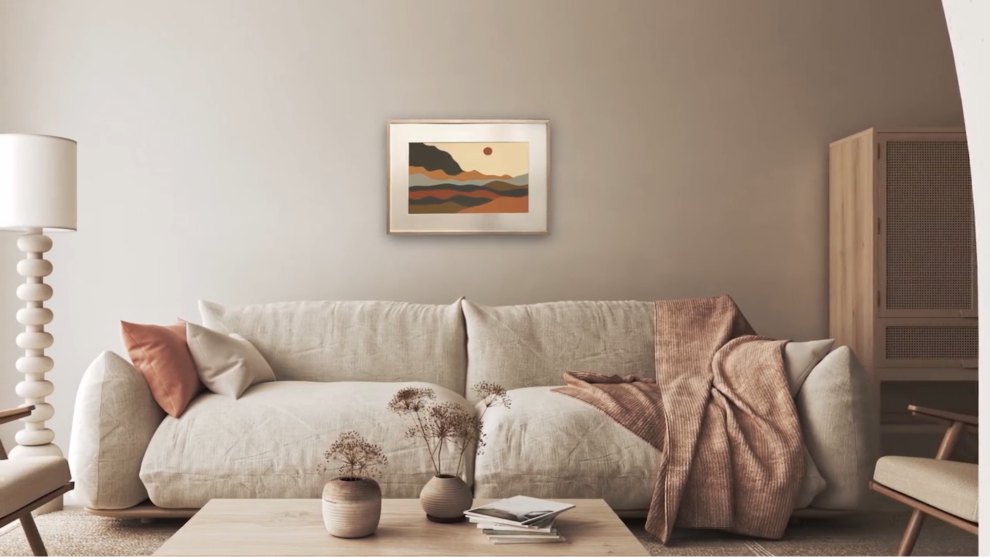 A living room wall showing a smart picture frame above a sofa