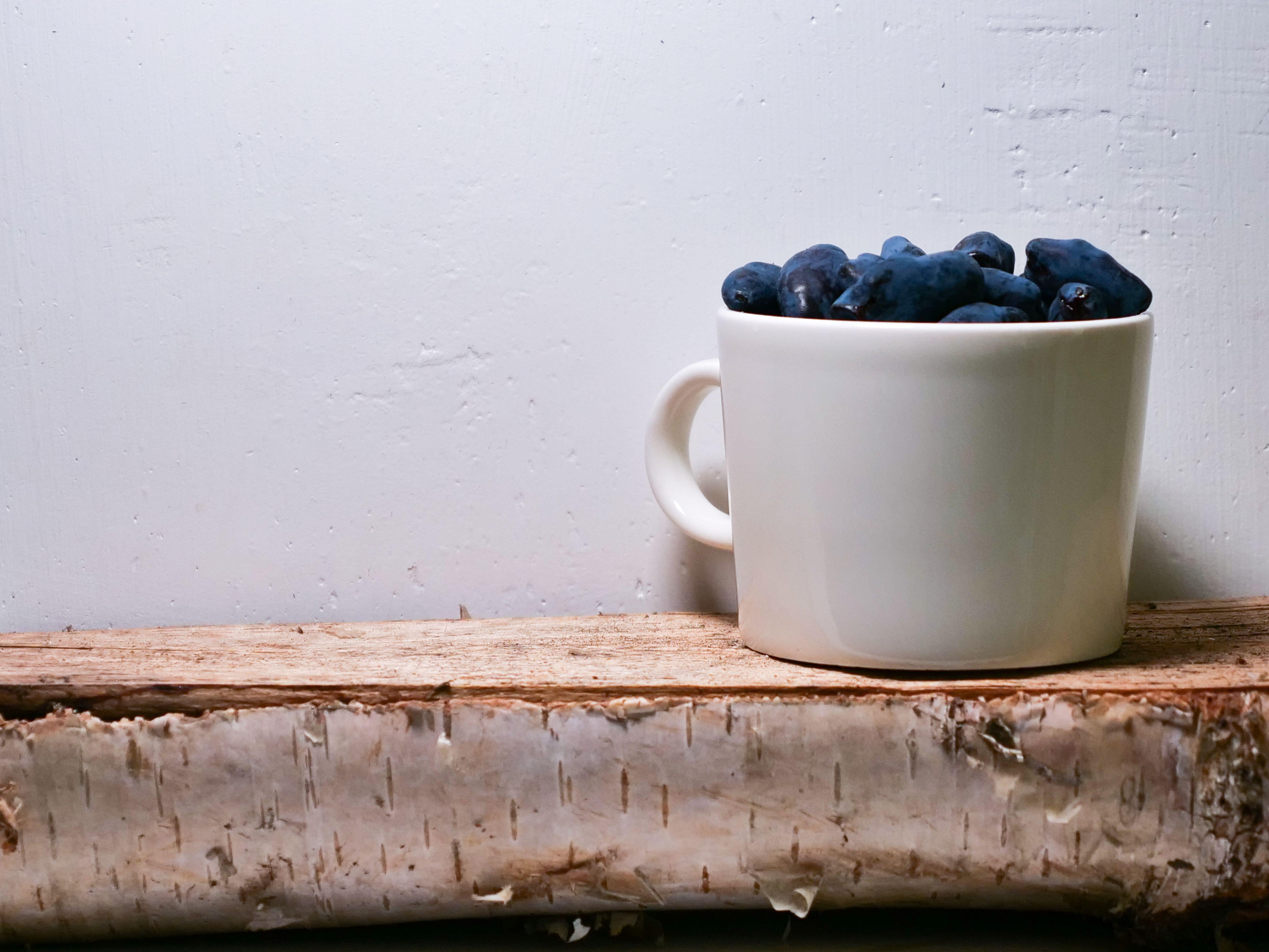 Honeyberries in a mug