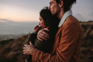 Home date ideas: A couple watching a sunset