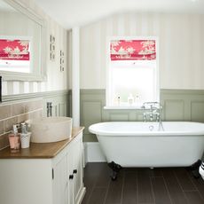 bathroom with freestanding bathtub and wooden flooring