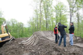 Workers prepare the four cross course.