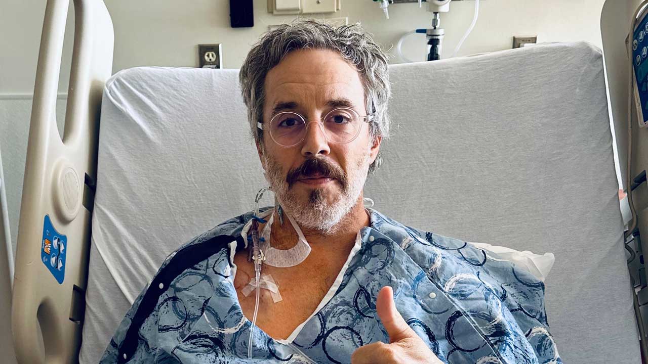 Ryan Hamilton in a hospital bed