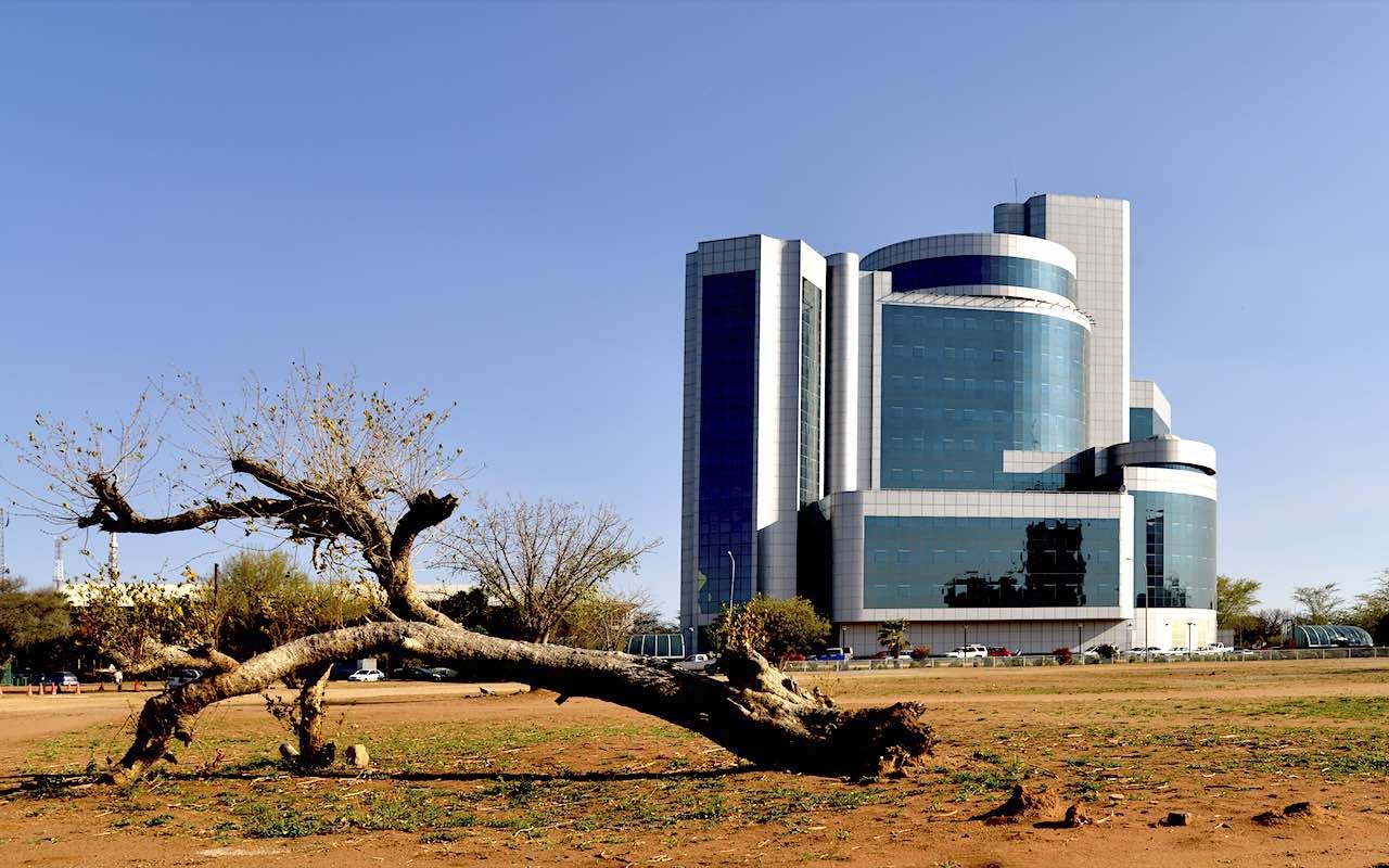 One of the huge newbuildings that have been erected in the last few years in Gabarone. Gabarone is the capital city of Botswana in Africa. In front of the building on land that will eventualy