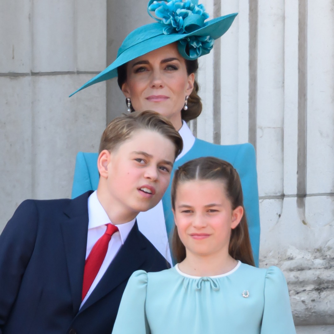 King George wears a navy suit with a white shirt and red tie, Princess Charlotte wears a light turquoise dress, and Kate Middleton wears an aquamarine coat dress to Trooping the Colour 2025