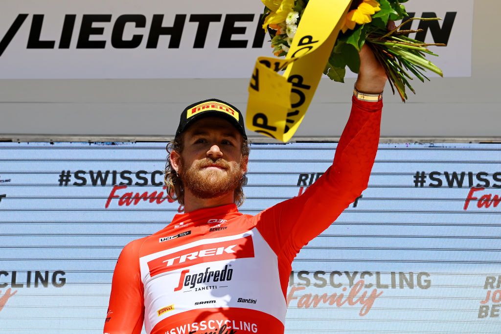 VADUZ LIECHTENSTEIN JUNE 19 Quinn Simmons of United States and Team Trek Segafredo celebrates winning the red mountain jersey on the podium ceremony after the 85th Tour de Suisse 2022 Stage 8 a 256km individual time trial stage from Vaduz to Vaduz tourdesuisse2022 WorldTour ITT on June 19 2022 in Vaduz Liechtenstein Photo by Tim de WaeleGetty Images