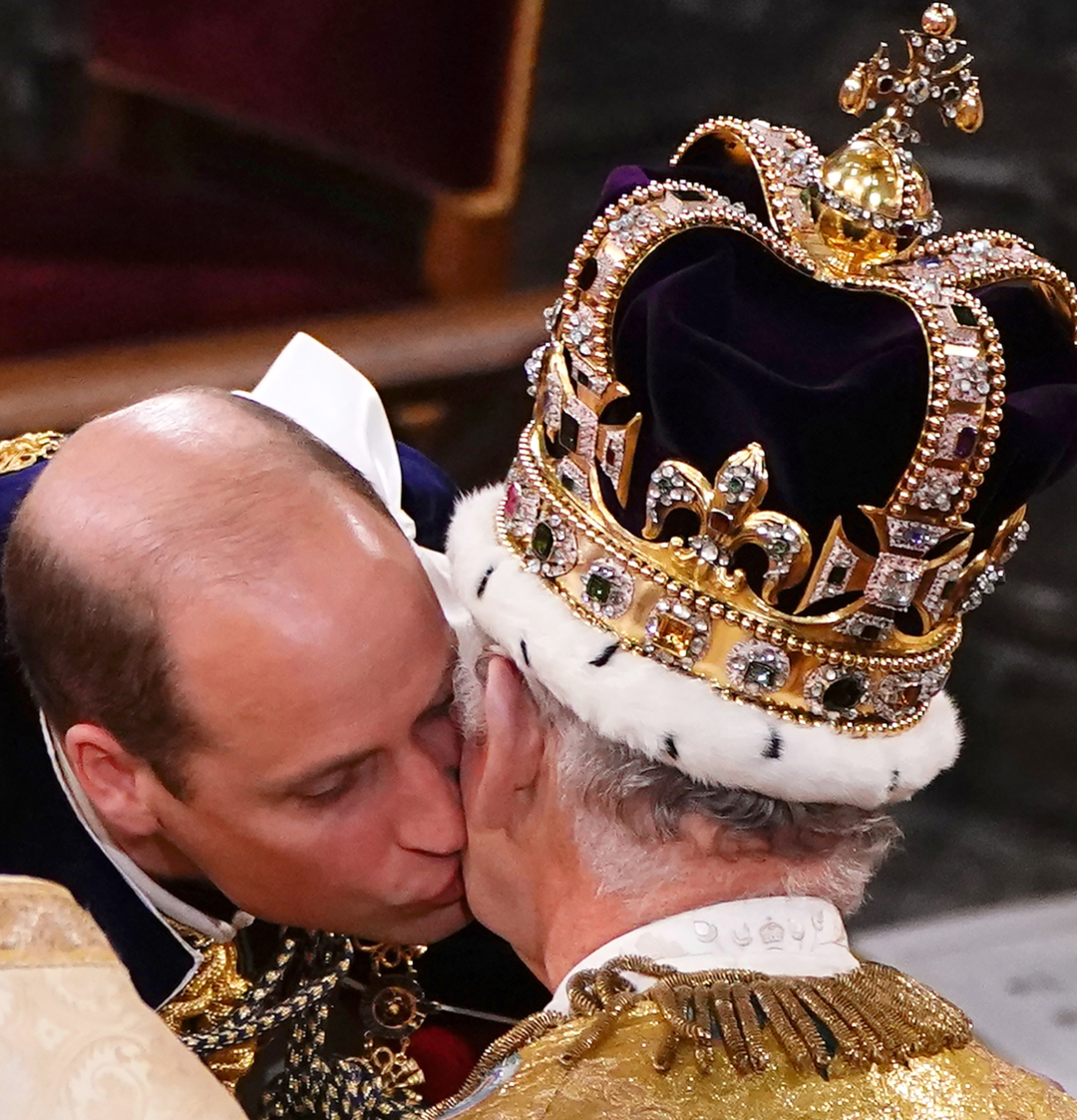 Prince William kissing King Charles at his coronation
