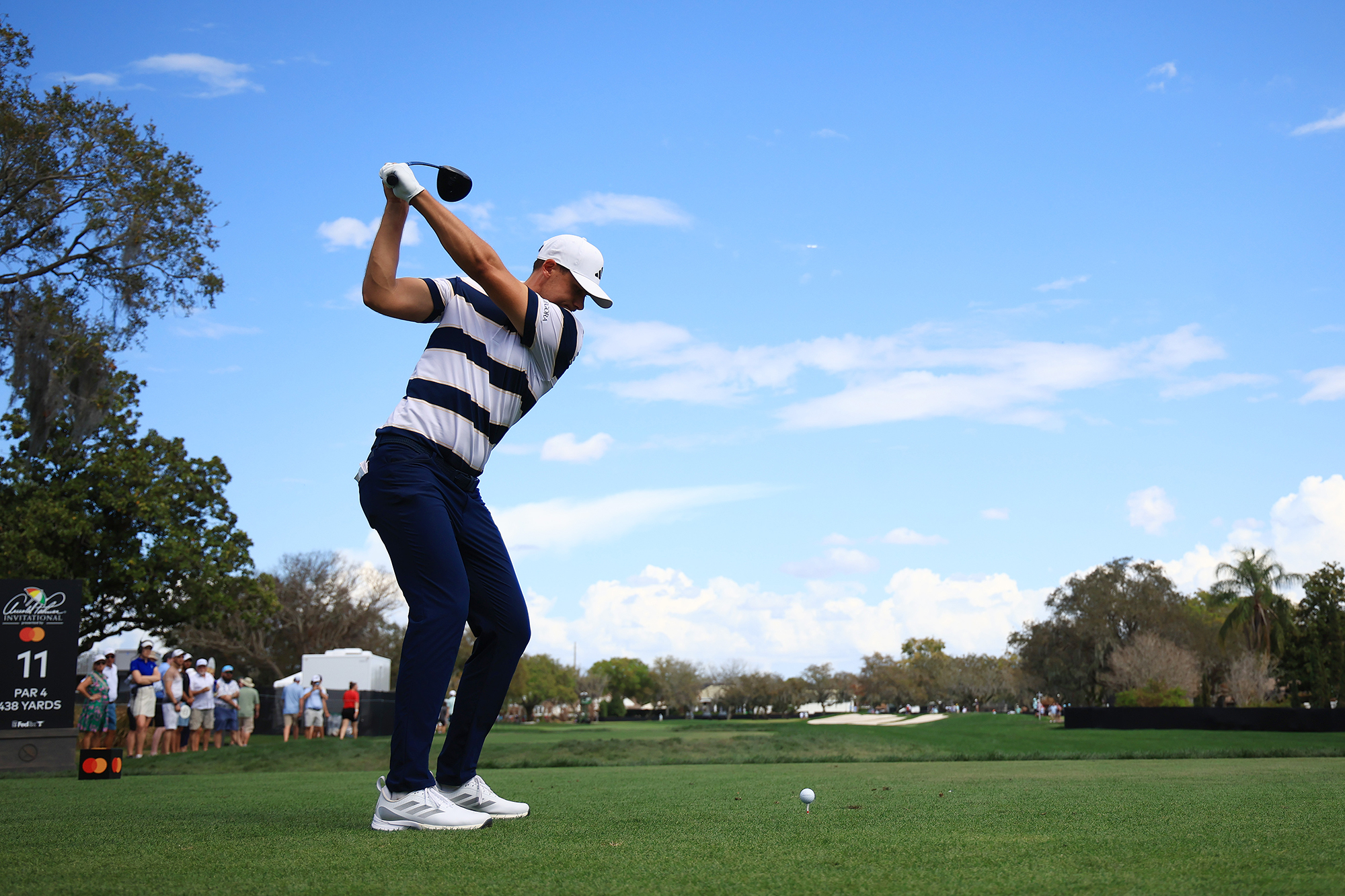 Ludvig Aberg at the top of his backswing with driver, about to hit a tee shot at the Arnold Palmer Invitational