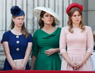 Lady Louise Windsor, Princess Eugenie and Princess Beatrice stand on the balcony of Buckingham Palace during Trooping The Colour 2018