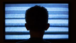 Boy watching television with noise; Shutterstock ID 169300625; purchase_order: -; job: -; client: -; other:
